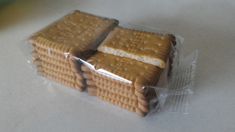 [image: a packet of 12 biscuits with 1 biscuit missing half of itself]